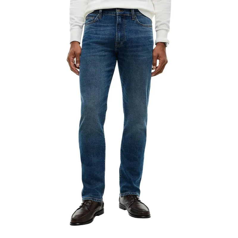 Tommy Hilfiger Jean slim pour homme en denim bleu délavé avec de subtiles moustaches, vue de face