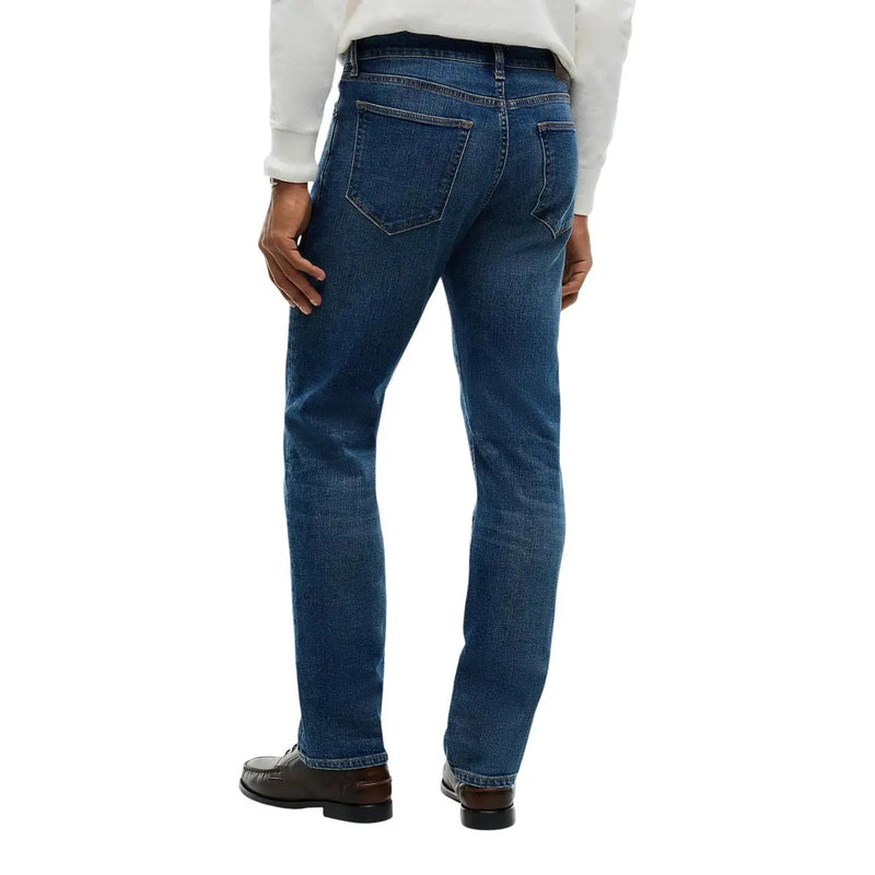 Tommy Hilfiger Jean slim pour homme en denim bleu foncé, coupe droite classique et coutures apparentes, vue de face