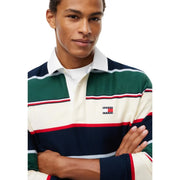 Tommy Hilfiger Polo rayé pour homme à rayures horizontales bleu marine, vert, crème et rouges, vue de face