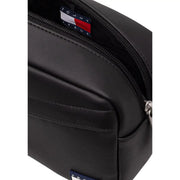Tommy Hilfiger Trousse de toilette quotidienne pour homme en cuir noir avec fermeture éclair et étiquette logo, vue de face