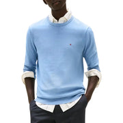 Tommy hilfiger men’s light blue crewneck sweater with white collar and logo.