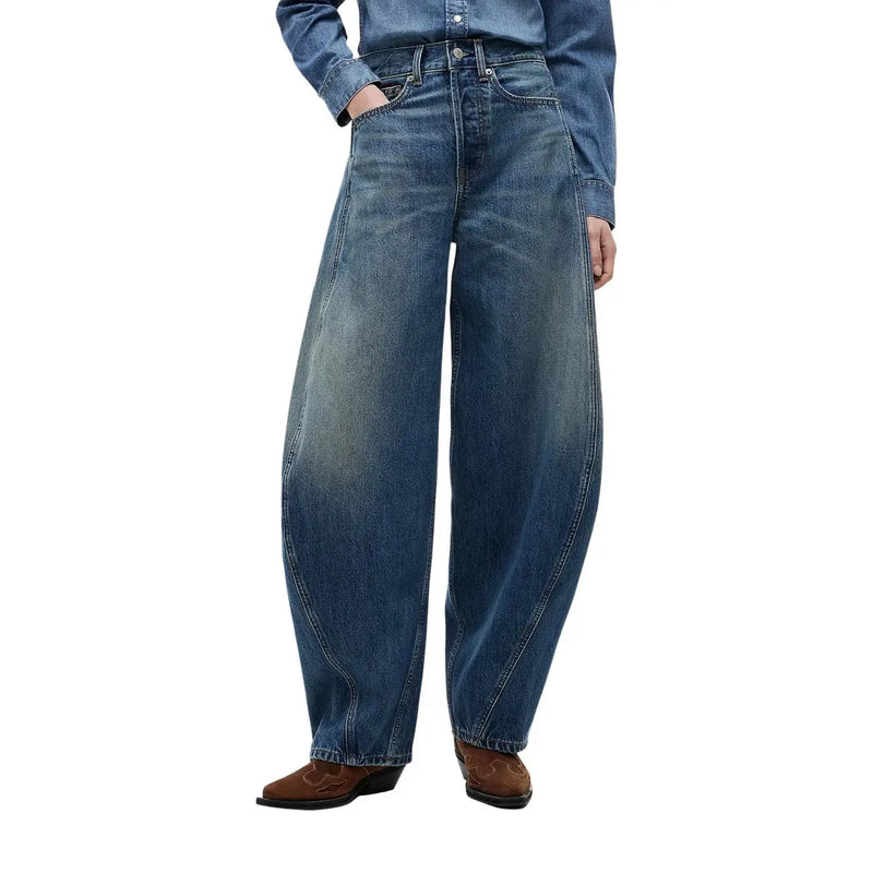 Tommy Hilfiger Jean en denim bleu pour femme, coupe mi-mollet, taille haute, jambes larges, délavage moyen avec subtils effets de décoloration et détails de surpiqûres.