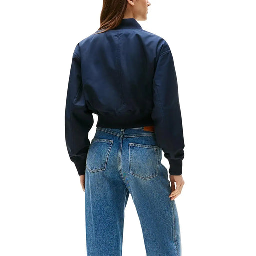 Tommy Hilfiger Blazer bleu marine en polyester à fermeture éclair pour femme, coupe ajustée et poignets côtelés.