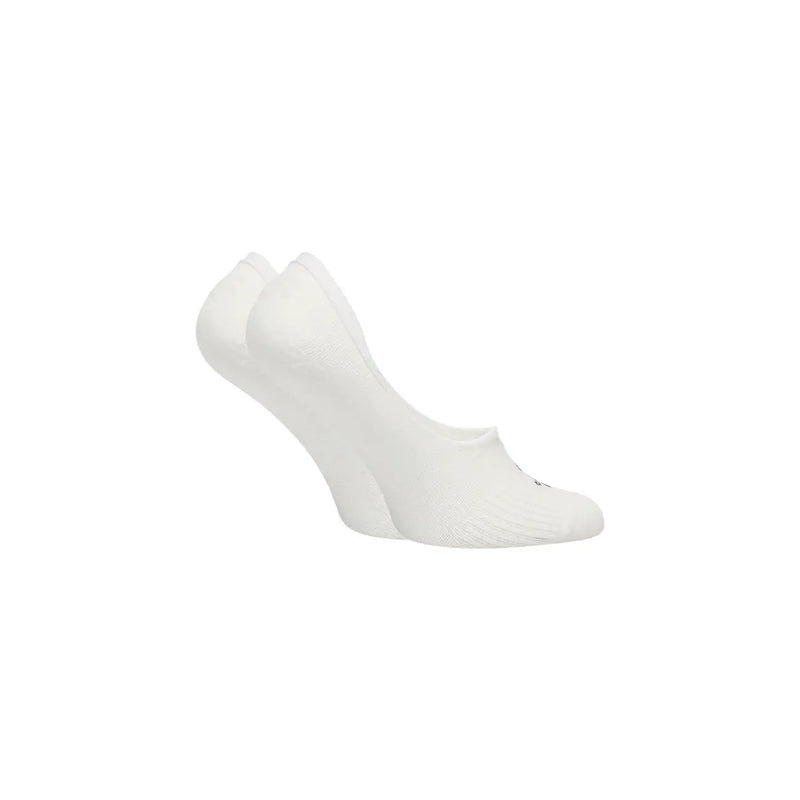 Tommy Hilfiger Chaussettes invisibles blanches en coton pour femmes, finitions lisses et sans coutures, avec un logo discret sur le bout des orteils.