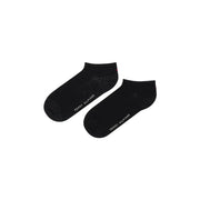 Tommy Hilfiger Chaussettes noires en coton pour femmes, avec un logo blanc discret sur le côté, idéales au quotidien.