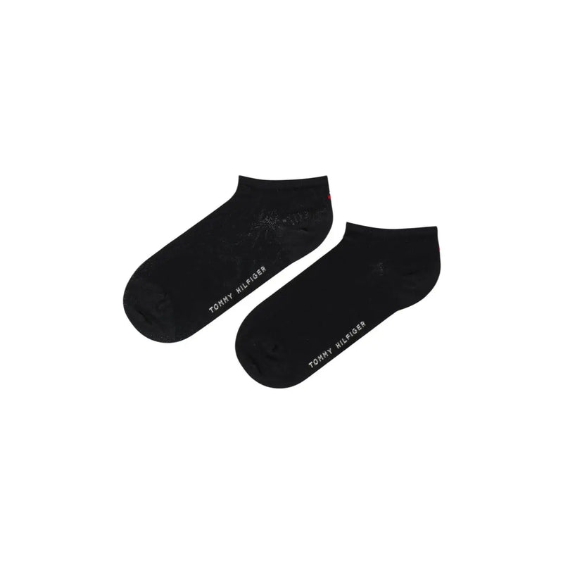 Tommy Hilfiger Chaussettes noires en coton pour femmes, avec un logo blanc discret sur le côté, idéales au quotidien.