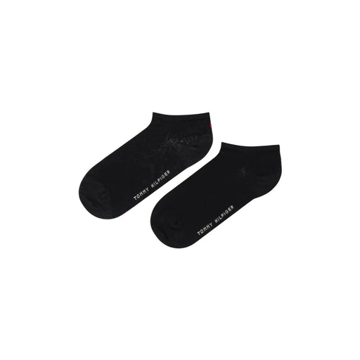 Tommy Hilfiger Chaussettes noires en coton pour femmes, avec un logo blanc discret sur le côté, idéales au quotidien.