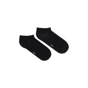 Coton noir Tommy Hilfiger Chaussettes basses pour femmes avec un texte blanc discret et un motif léger près du talon.
