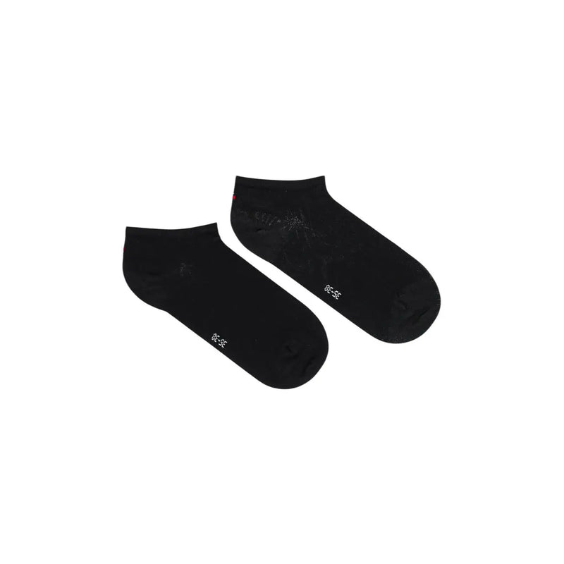 Coton noir Tommy Hilfiger Chaussettes basses pour femmes avec un texte blanc discret et un motif léger près du talon.