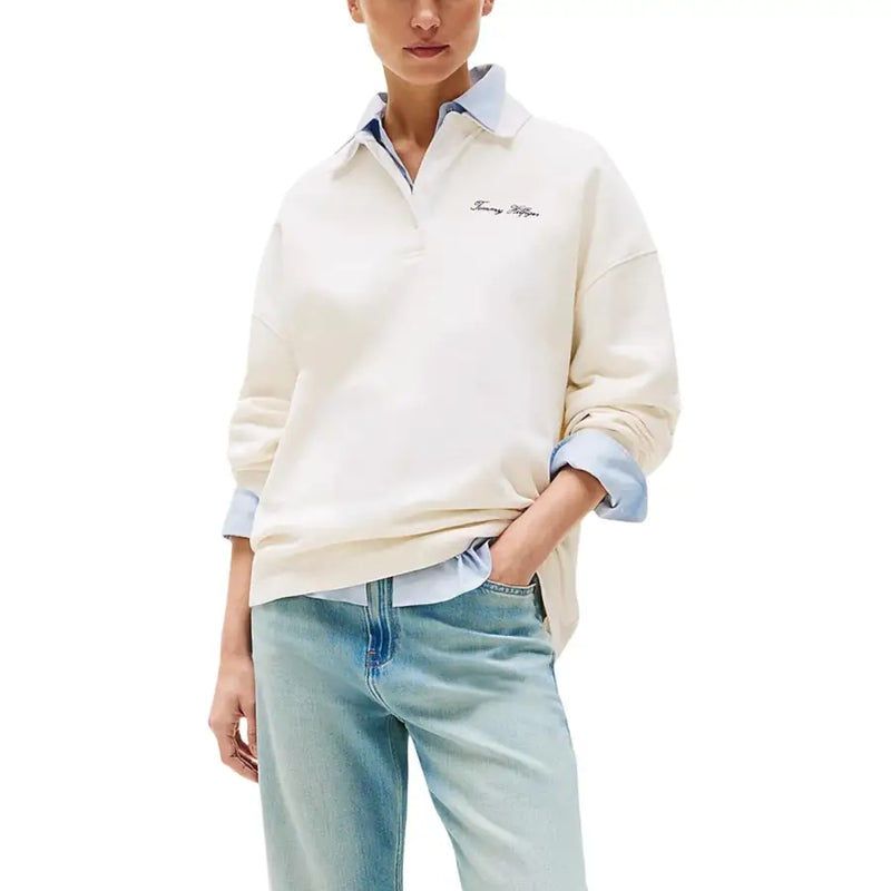 Tommy Hilfiger cream polo shirt with light blue accents and embroidered logo