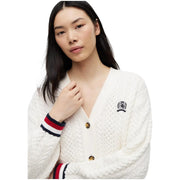 White organic cotton cable-knit cardigan with red white navy striped cuffs and tommy hilfiger logo patch on chest