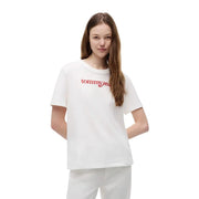 T-shirt court blanc Tommy Hilfiger pour femme, en coton biologique, avec logo rouge brodé sur le devant.