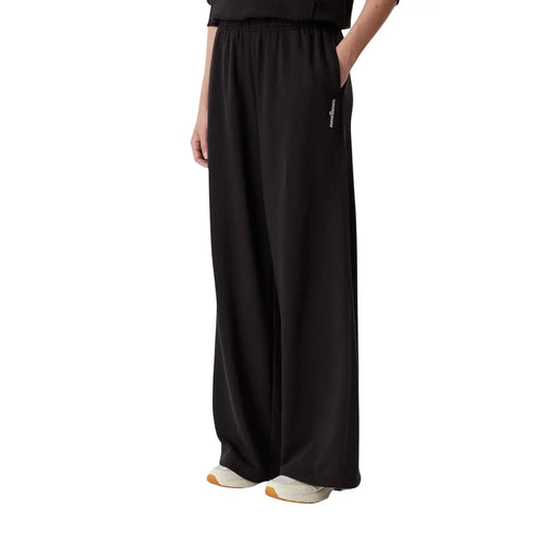 Tommy Hilfiger Pantalon de survêtement large pour femme en coton noir, avec un tissu fluide et doux et un logo discret sur le côté.