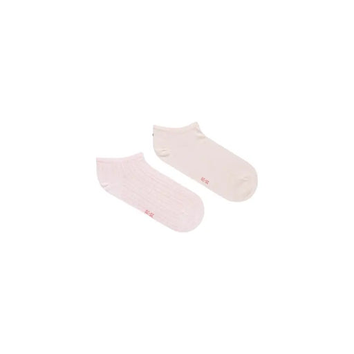A pair of tommy hilfiger women’s pink cotton ankle socks with soft texture and small red branding on the side