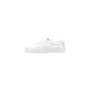 Tommy Hilfiger women’s white cotton low-top sneakers with minimalist design and gold-tone accents on eyelets and heel tab