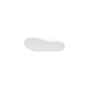 Tommy Hilfiger women’s white cotton sneakers with a white rubber sole featuring a textured grid-like pattern