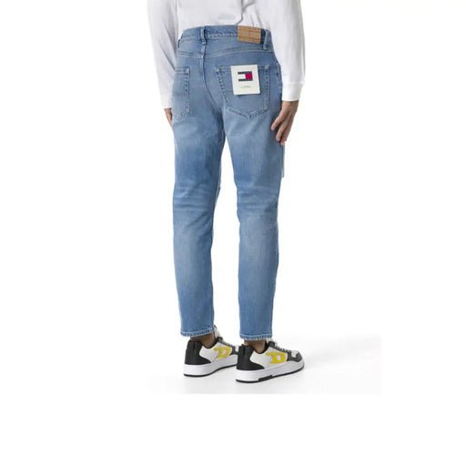 Tommy hilfiger light blue denim jeans with a classic fit and red tab.