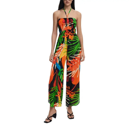 Tropical print halter jumpsuit with floral design, perfect for summer and beachwear