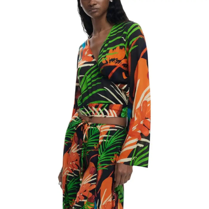 Tropical print wrap top and matching pants set displayed for fashionable summer wear