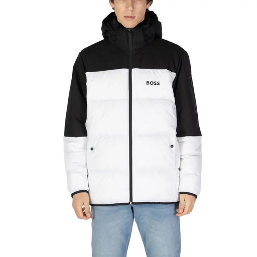 Two-tone hooded puffer jacket in black and white with a sleek, stylish design