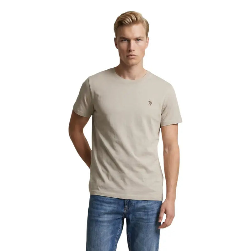T-shirt homme beige US Polo Assn. en coton, coupe classique, manches courtes, col rond et petit logo brodé sur la poitrine.