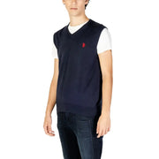 Navy blue knit v neck sleeveless sweater with small red embroidered logo on left chest by U.S. Polo Assn