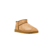 Bottines Ugg pour homme en daim beige clair avec intérieur en peluche douce et design hivernal classique à tige basse