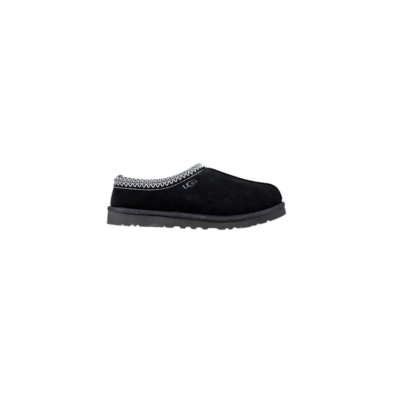 Mocassin UGG noir à enfiler avec tige en daim texturé et surpiqûres blanches en zigzag, idéal pour un confort optimal en automne et en hiver