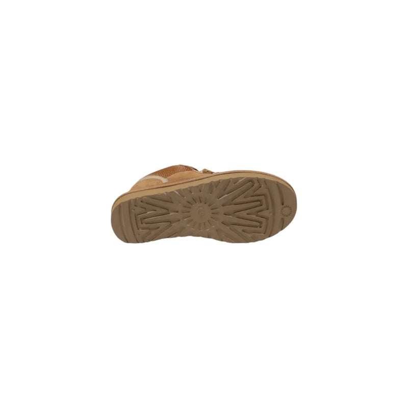 Tan ugg women’s sneaker with suede upper and rubber sole featuring ugg starburst tread pattern