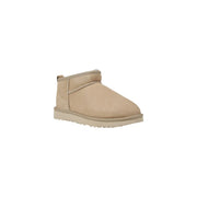 Beige ugg women leather mini boot with suede upper and rubber sole designed for spring footwear