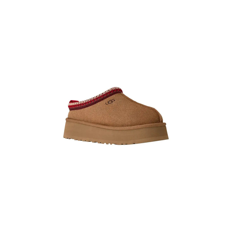 Ugg women suede platform slippers in beige with tan slip-on mule design and red and white patterned trim around the opening