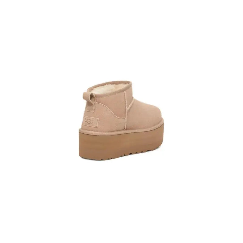 Ugg women’s beige suede ankle boots with plush shearling lining and tan rubber sole for fall winter collection