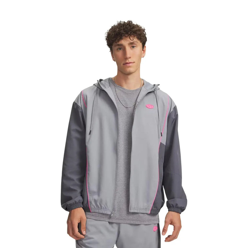 Under Armour Veste coupe-vent à capuche grise en polyester pour homme, avec un design bicolore et des liserés roses.