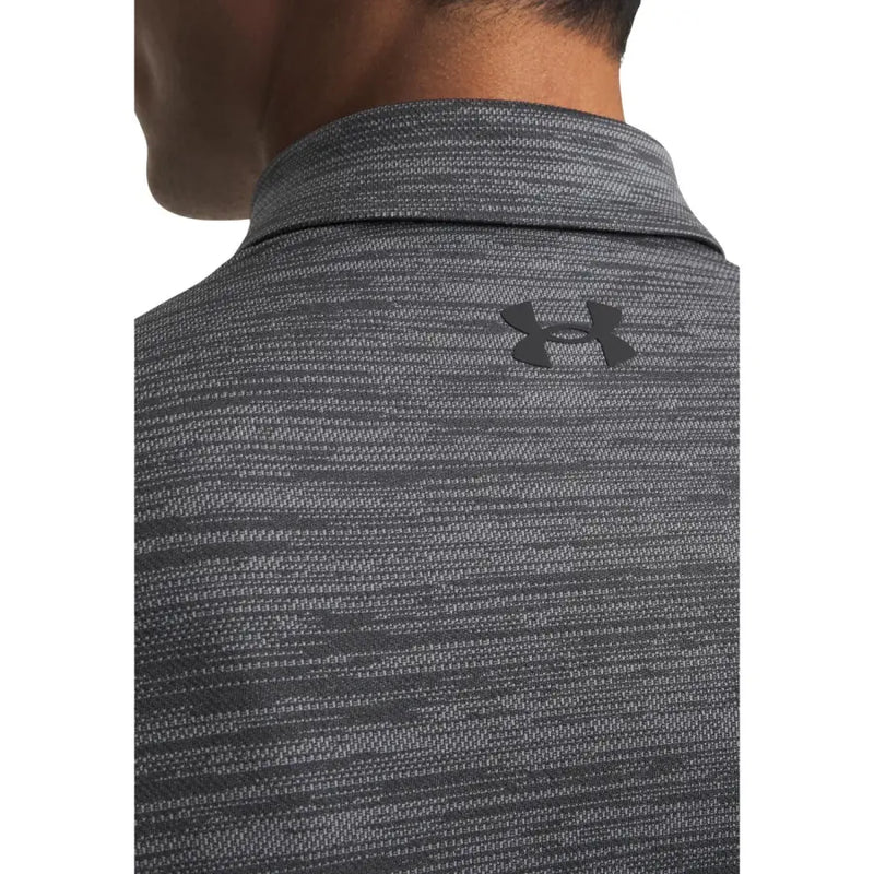 Under armour Polo homme en polyester gris foncé, orné d'un discret motif chiné et d'un logo sur la poitrine.