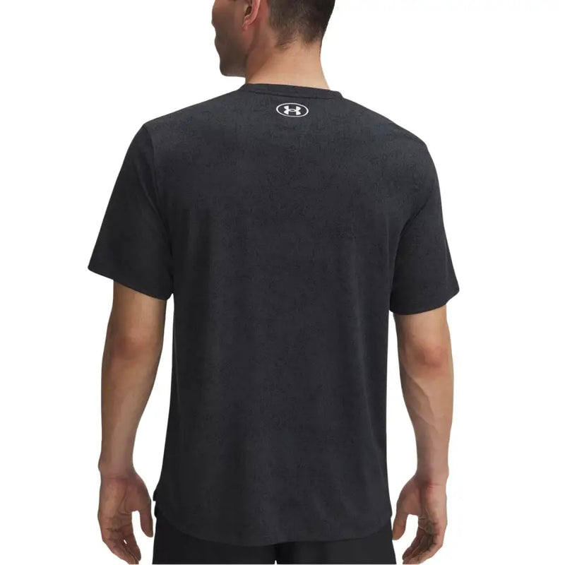 Under Armour hommes t-shirt en noir avec une texture chinée subtile et un logo centré au niveau de l'encolure