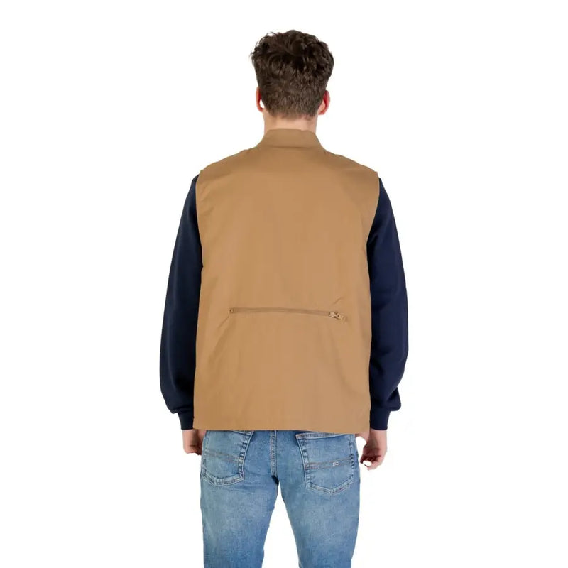 Brown utility vest with pockets and zipper, likely made of canvas or similar durable material.