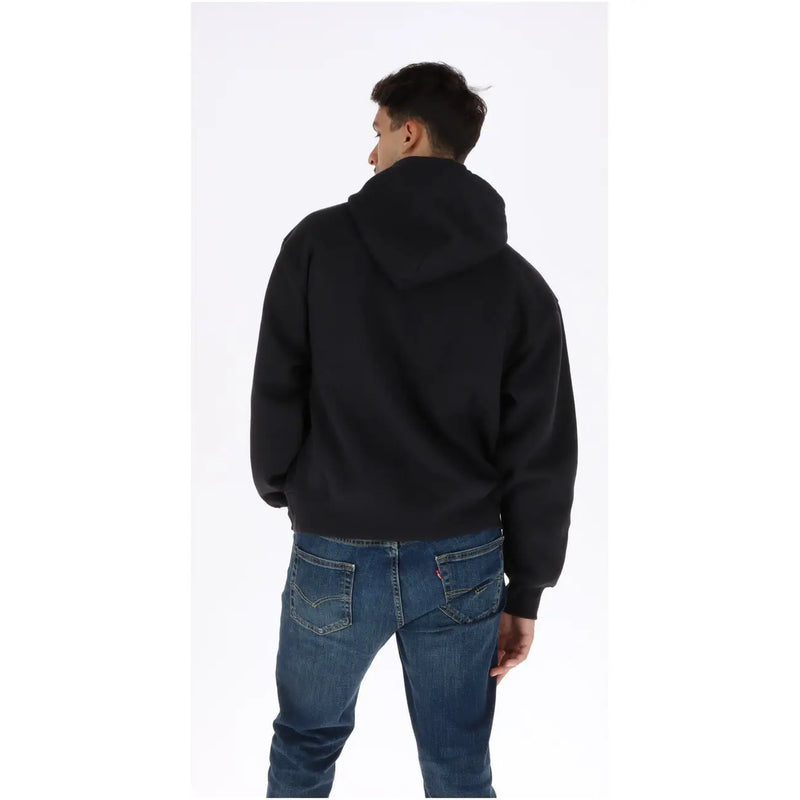 Sweat à capuche noir Vans pour homme en coton, coupe décontractée et douce, poignets côtelés noirs.