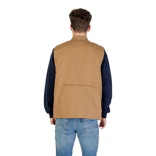 Vue arrière du gilet long zippé beige Vans pour homme, composé d'un gilet utilitaire beige avec poche zippée.