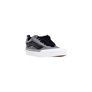 Black and gray vans skate shoe with white sole.