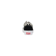 Baskets Vans pour homme en cuir noir, édition printemps-été, à boucle, motif à damier noir et blanc et étiquette rouge au talon.