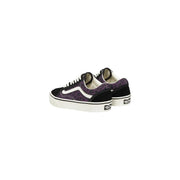 Baskets Vans Old Skool pour homme en cuir noir léopard avec imprimé léopard violet, empiècements en daim noir et semelles en caoutchouc blanc.