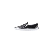 Baskets Vans pour homme, en tissu noir, à enfiler, avec motif à damier noir et gris et semelle en caoutchouc blanc.