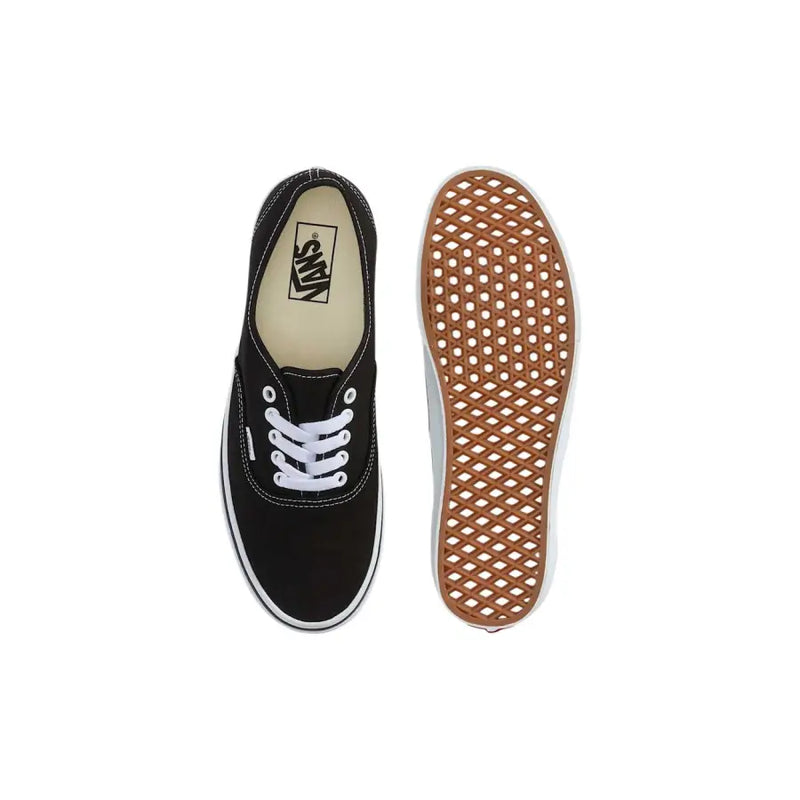 Baskets Vans pour homme, en tissu noir à lacets blancs et semelle en caoutchouc beige à motif losanges.