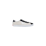 Baskets Vans pour homme en daim multicolore beige et noir, lacets blancs, semelle en caoutchouc blanc et logo classique sur le côté