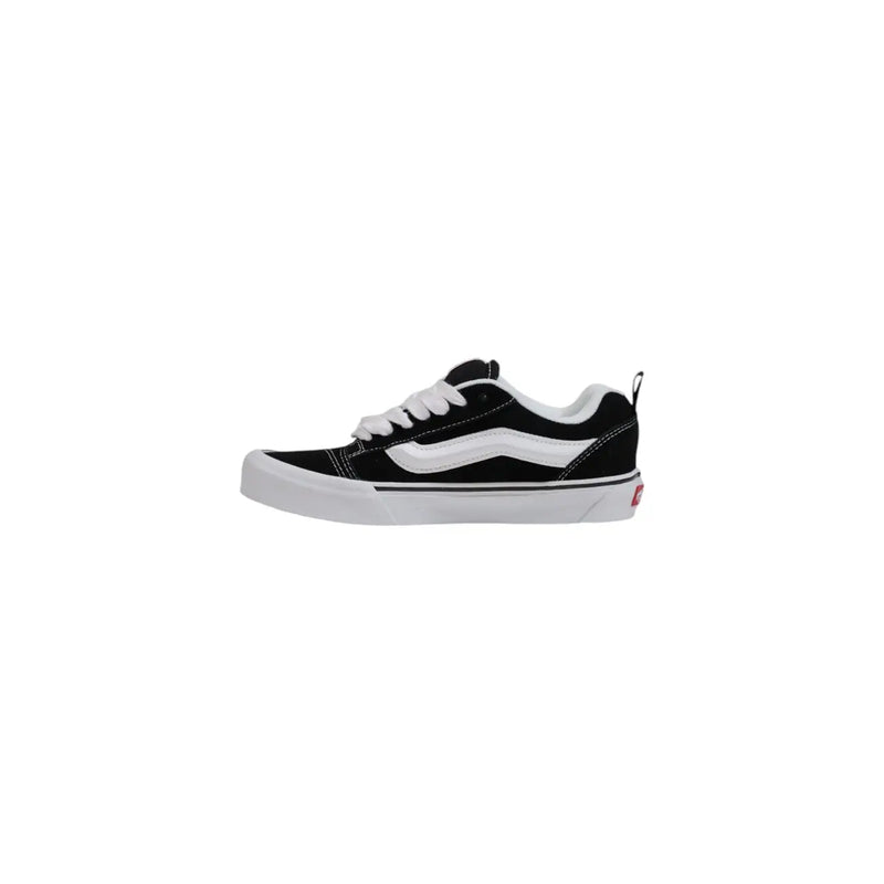 Back side of black and white vans old skool skate shoe with canvas upper rubber sole and red logo on heel for women