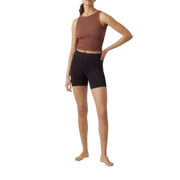 A ribbed rust-colored sleeveless crop top with high neckline paired with vero moda black polyamide elastane shorts