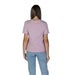 Back view of a person in a Vila Clothes Women’s Pink Cotton T-Shirt and light blue jeans