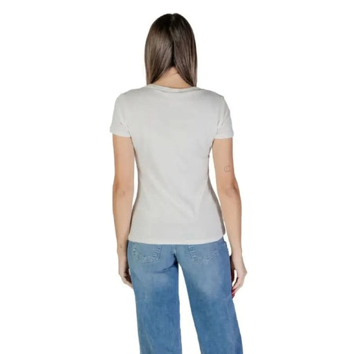 Back view of a person in Liu Jo Women’s White Round Neck T-Shirt and blue jeans