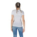 Back view of a person in a Guess Women’s Round Neck T-Shirt and blue jeans