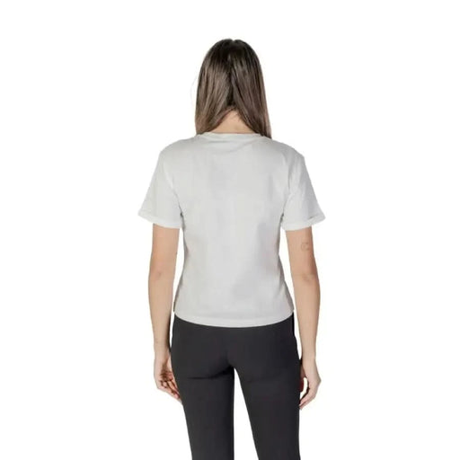 Back view of a person wearing Morgan De Toi Women’s V-Neck White Cotton T-Shirt